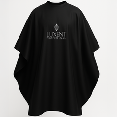 Capa de peluquería profesional negra con logo Luxent, ideal para proteger la ropa durante tra - Luxent Professional