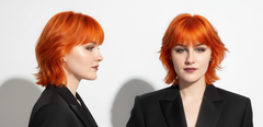 Modelo con cabello corto naranja vibrante, mostrando el color y estilo. - Luxent Professional